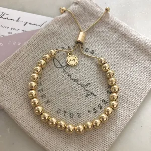 Gold beaded adjustable bracelet