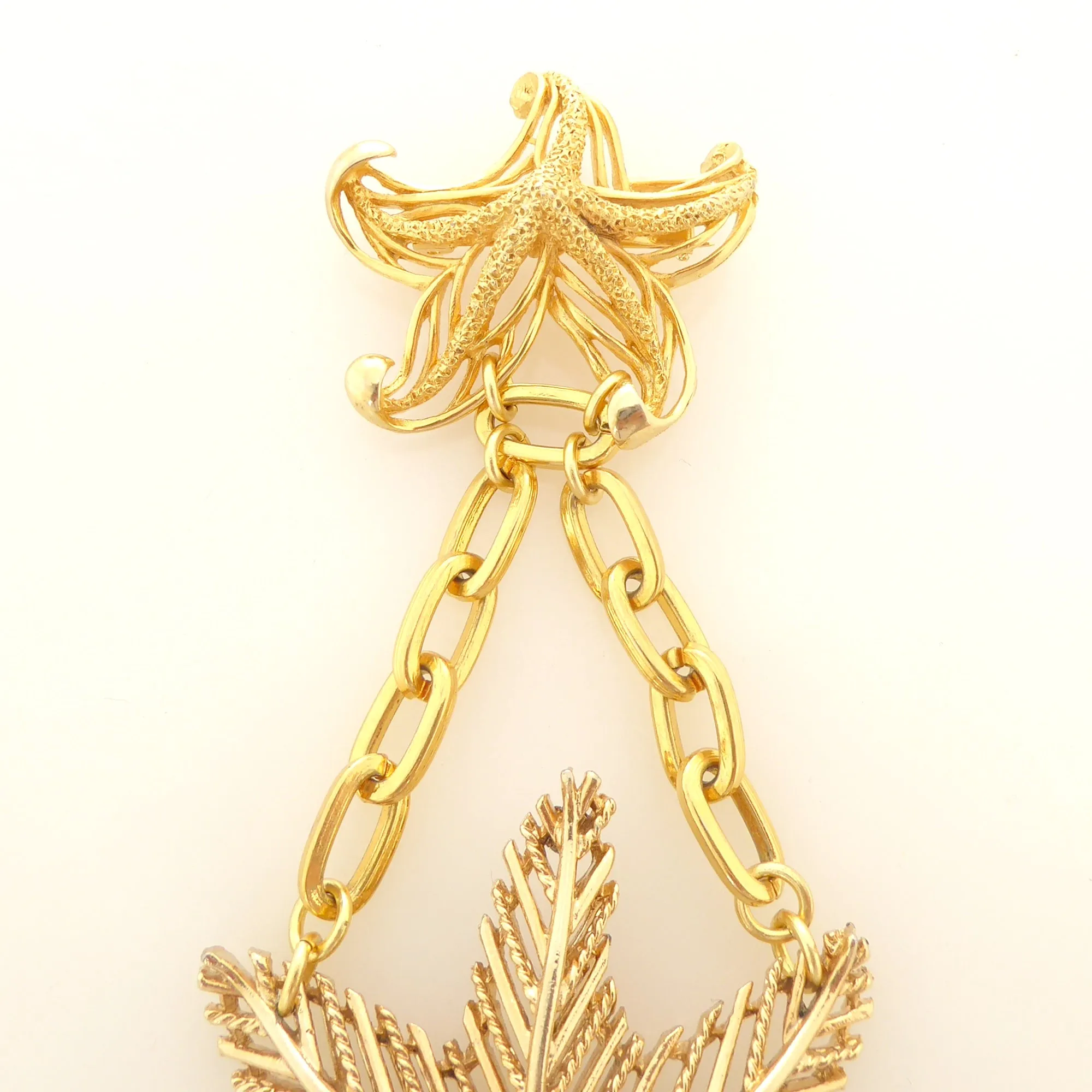 Gold starfish brooch