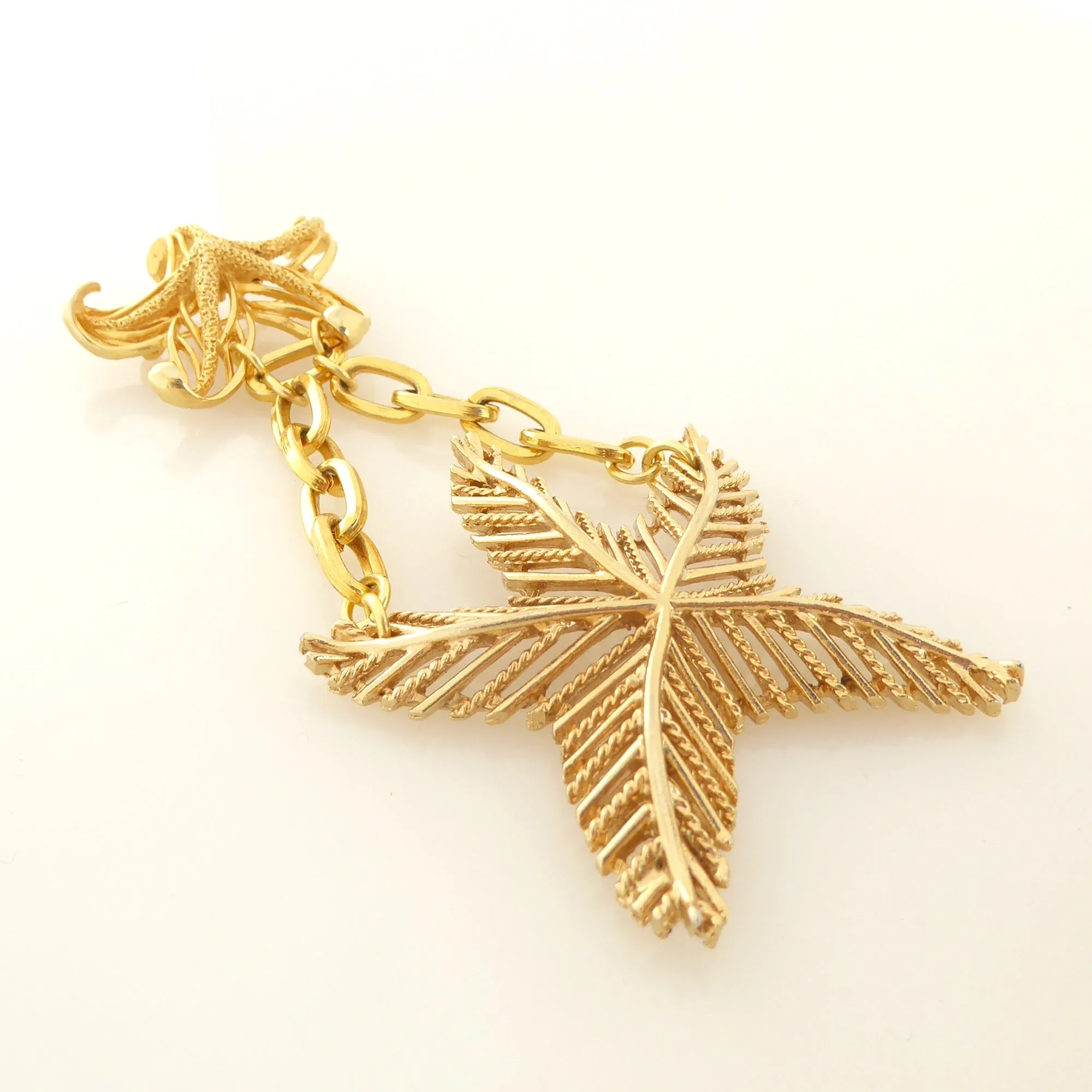 Gold starfish brooch