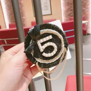 Number 5 Pearl Bow chain tassel Brooch