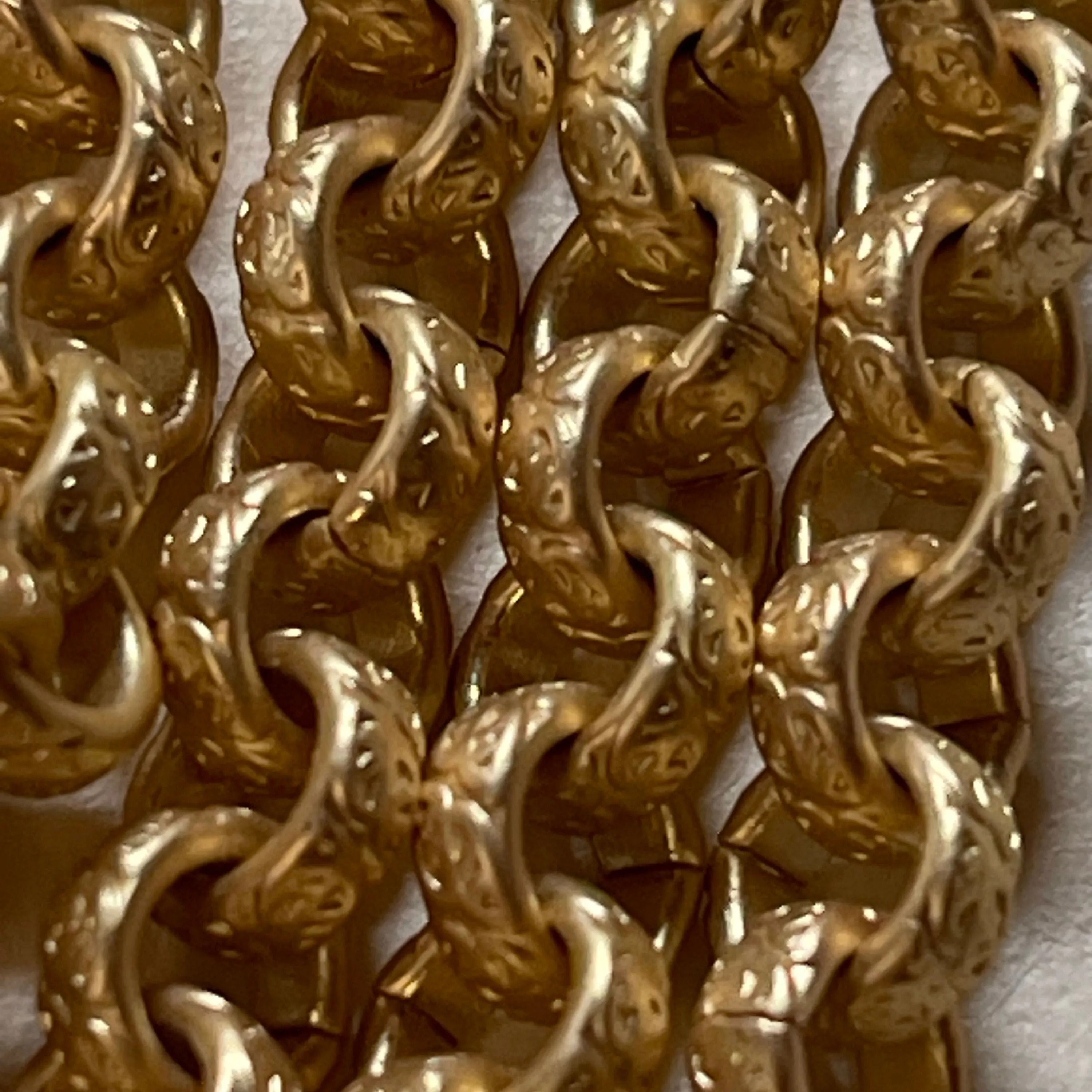 This Lovely Satin Gold Heavy Textured Chain is 6.3mm.  Sold by the foot.
