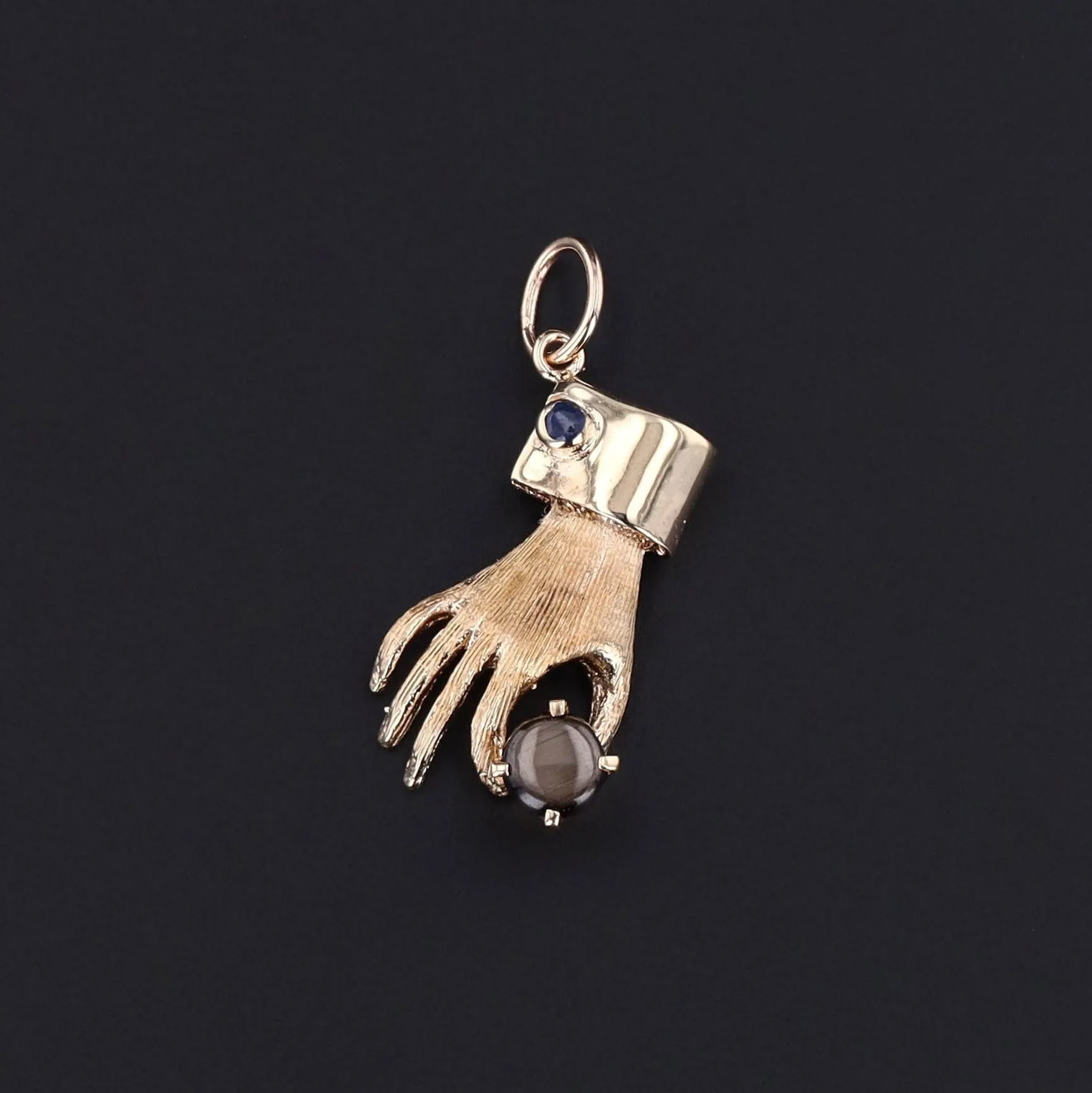 Vintage Hand Holding Gray Star Sapphire Charm of 14k Gold